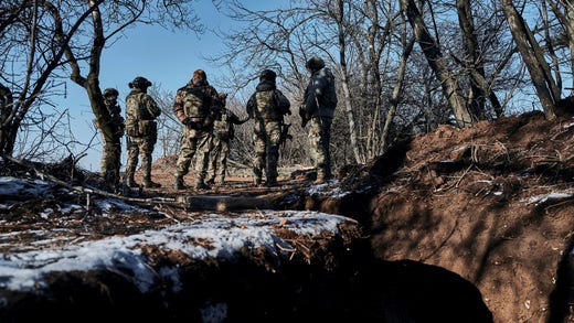 Ukrainian soldiers at a trench near the town of Pashmut, eastern Ukraine.