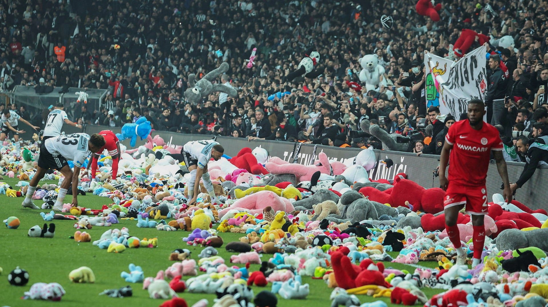 The crowd in protest against Erdogan – supporters threw stuffed animals onto the pitch