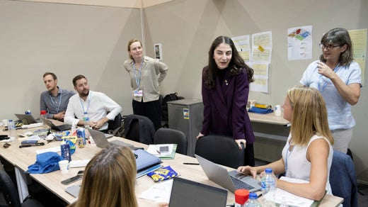 Climate Minister Romina Pourmokhtari (left) in the room of the Swedish delegation at COP27.