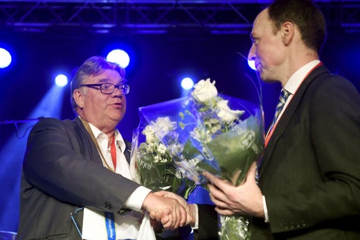 Timo Soini was the party leader of the True Finns for ten years.  Here he shakes hands with Jussi Halla-aho, the party's new leader, 10 June 2017.