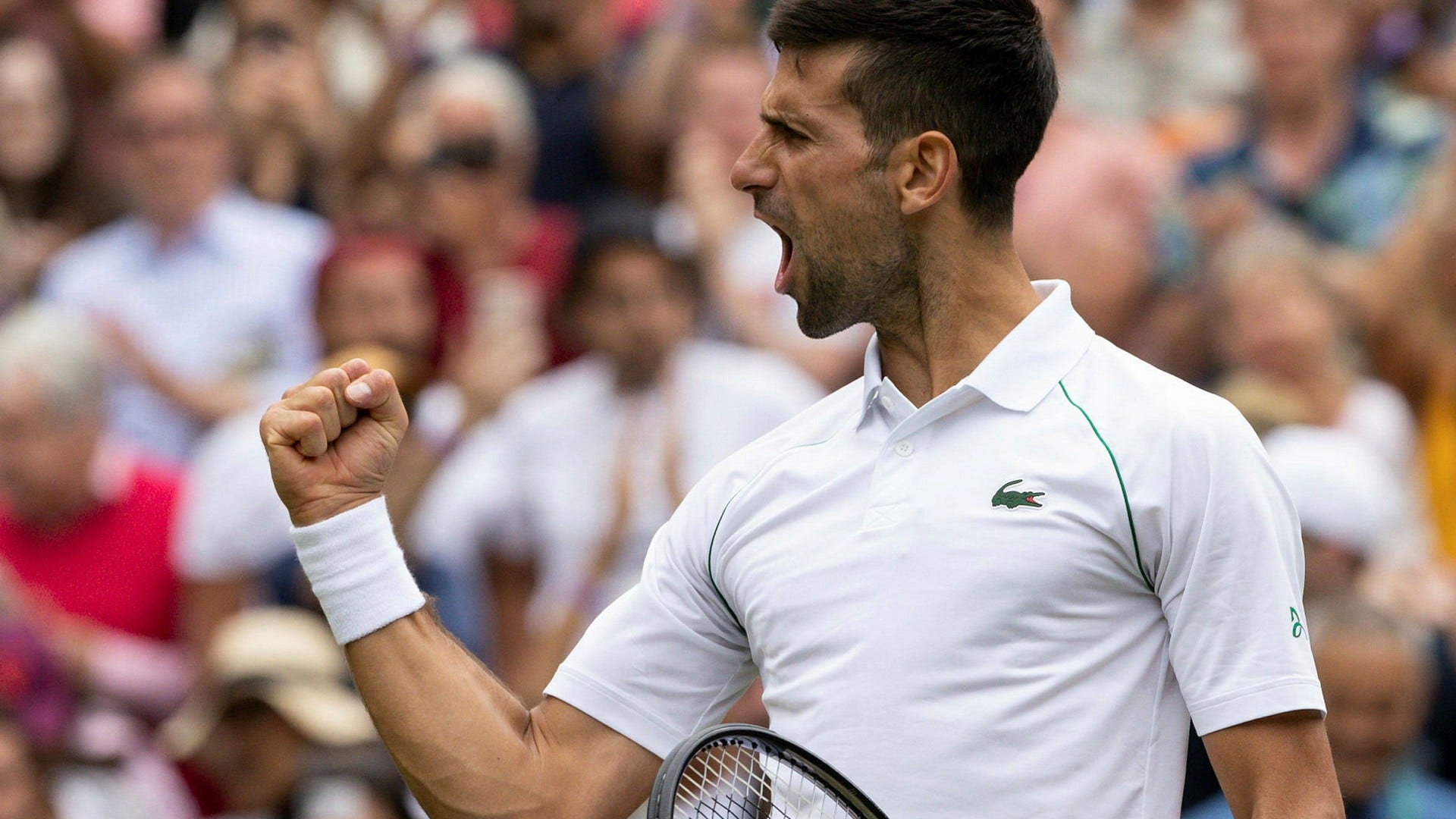 Novak Djokovic firar segern.