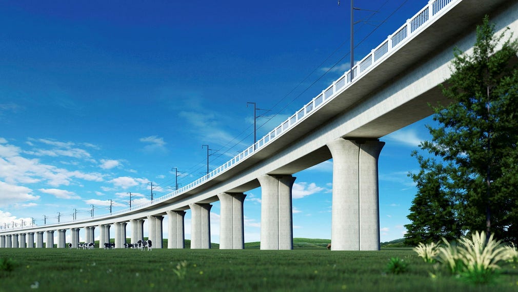 Genom att spåren ligger på pelare behöver marken inunder inte köpas upp, exproprieras, av staten, lyfter företagen som ett argument för så kallade landbroar. Bilden är datorgenererad.