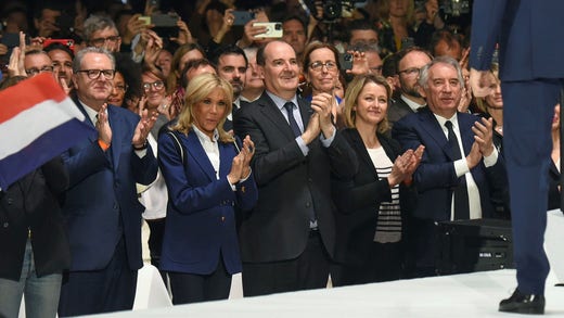 Brigitte Macron, wife of Emmanuel Macron (second from left) and Prime Minister Jean Castex pay tribute to the president.