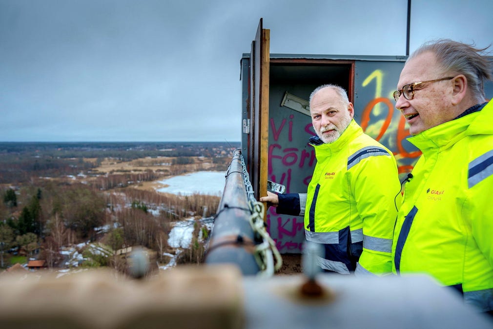 Site manager Stig Johansson (left) and CEO Grangex CEO Christer Lindqvist at the top of the 72 meter high mining tower.  Three miles away in the background is the nuclear power plant in Forsmark.