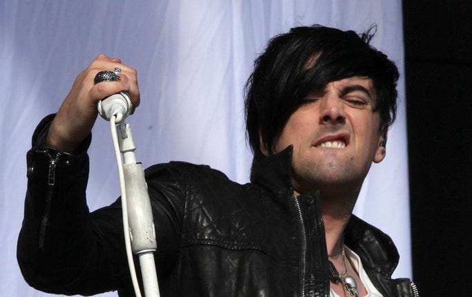 Ian Watkins under en konsert 2011.