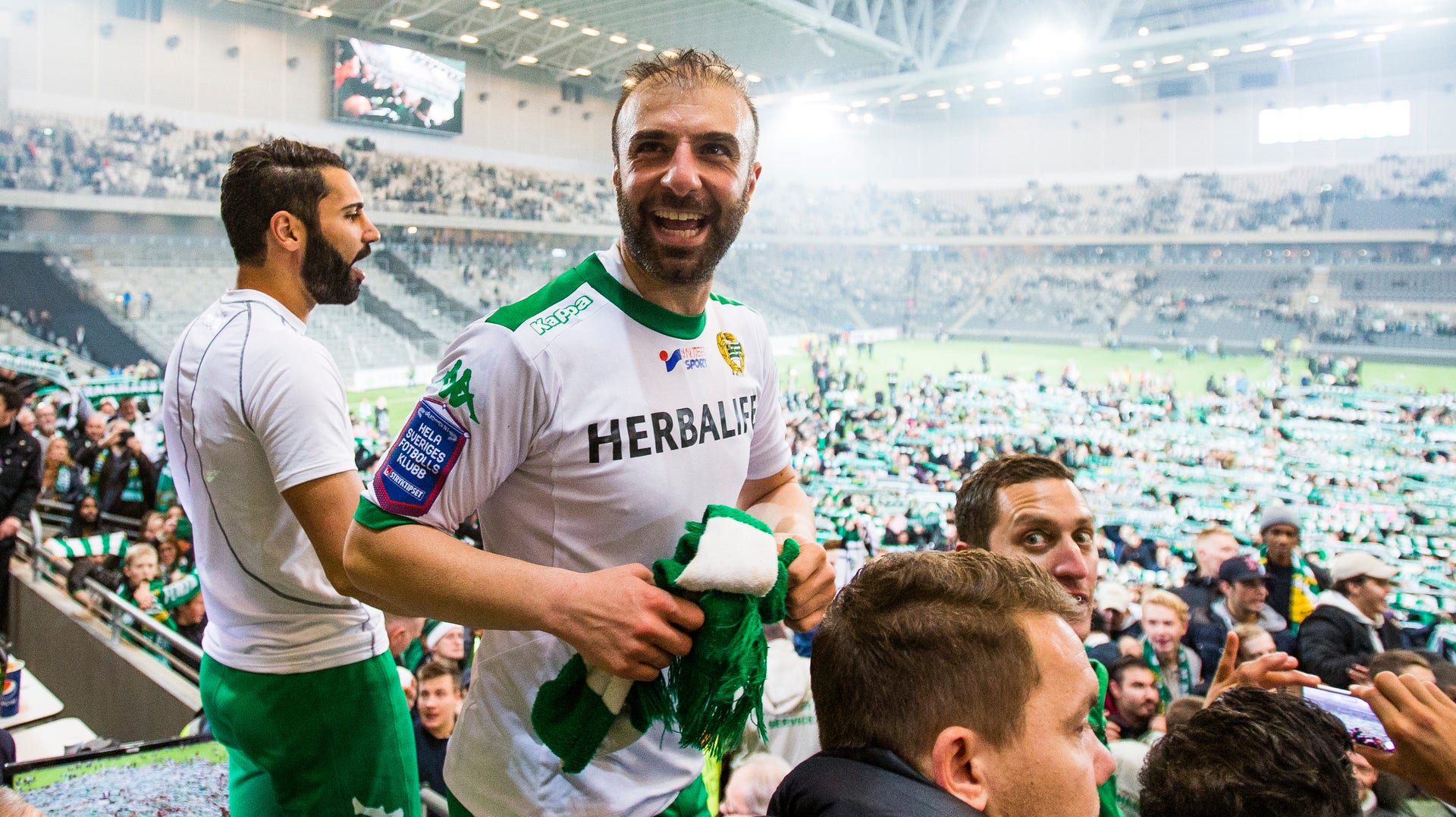 Hammarbyikonen Kennedy Bakircioglu firar avancemanget till allsvenskan efter segern mot Jönköping den 2 november 2014.