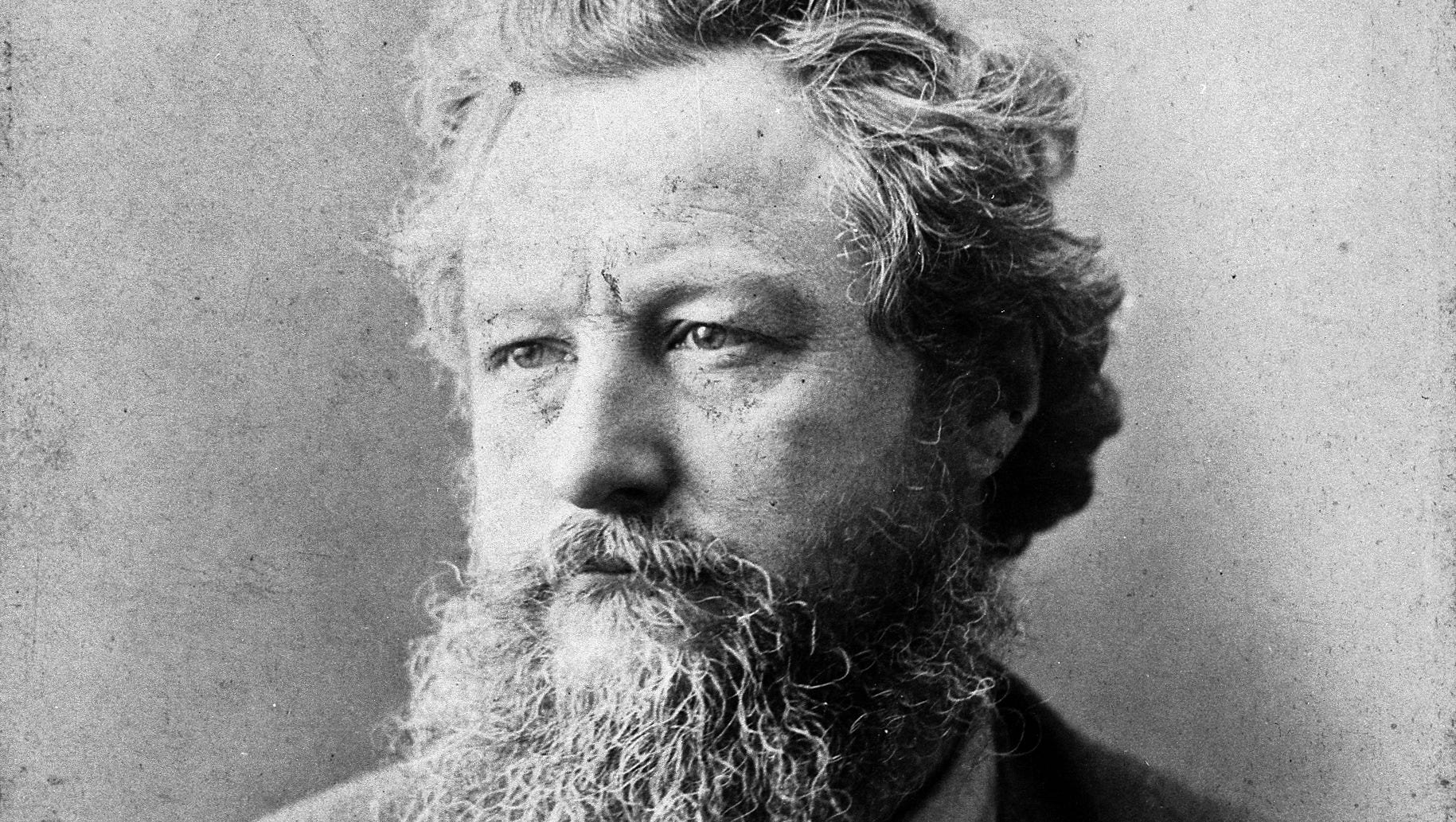 Porträttfoto av William Morris.